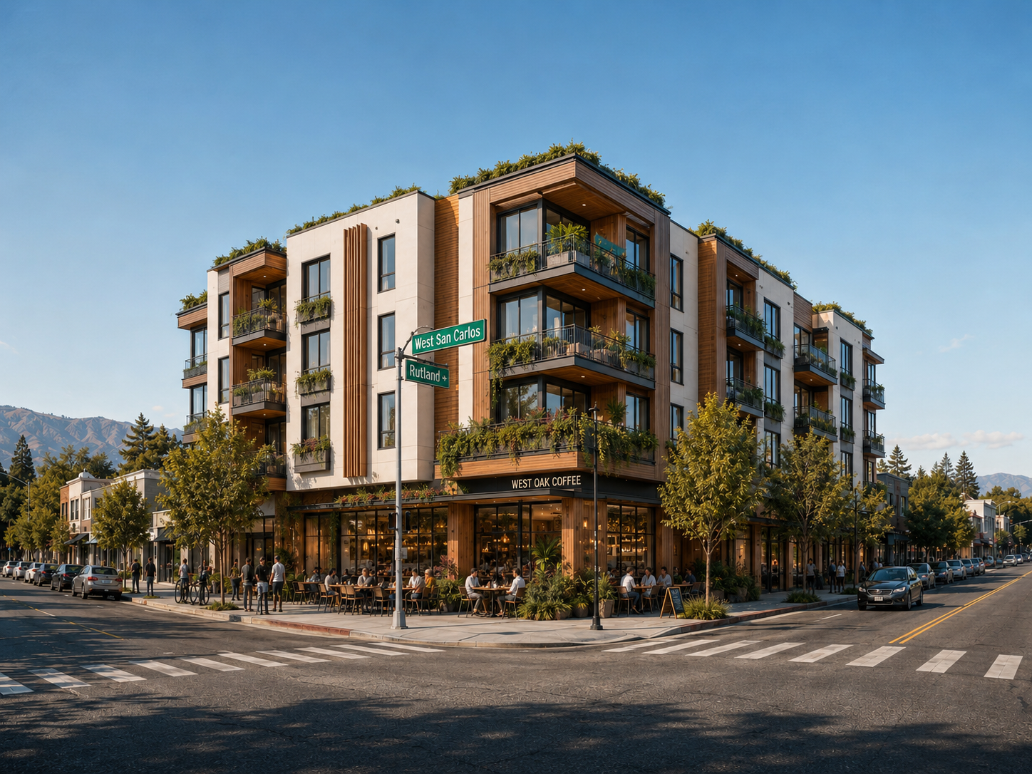 Street-level view of a five-story corner-wrapping mid-rise with ground-floor cafe at West San Carlos and Rutland